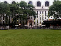 New York Public Library looms behind Bryant Park lawn.